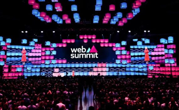 Web Summit 2024 in Lisbon, showcasing a vibrant stage and large audience, highlighting innovation and networking opportunities for startups.