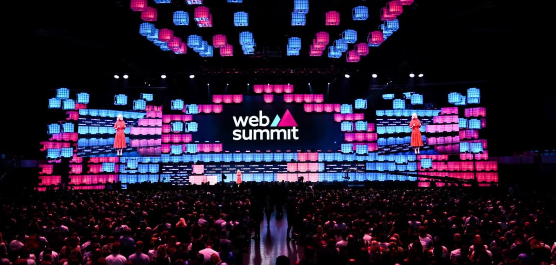 Web Summit 2024 in Lisbon, showcasing a vibrant stage and large audience, highlighting innovation and networking opportunities for startups.